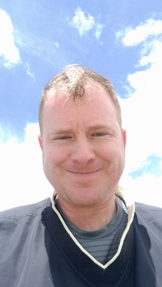 Robert Jenkins taking a selfie at the summit of Mount Blue Sky, Colorado